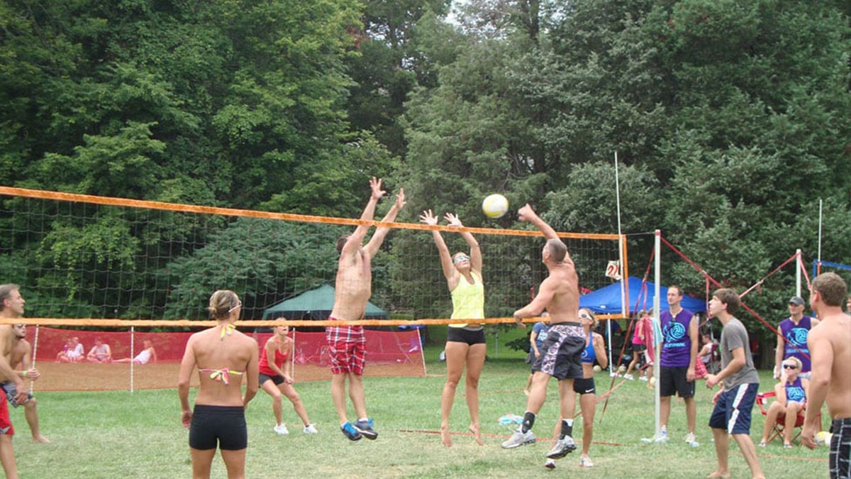 volleyball players spiking over the net at put-in-bay volleyball tournament